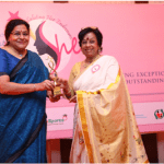 Dr Satbir Bedi giving award to Mrs Raj Kurup in Civic Work