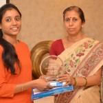Ms Meena Bhargava awarding the 2nd runnerup of JC Bhargava Award christy N Cherian
