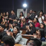 Seen students chering up to encourage their fellow classmates entertaining delegates of Global Impact Summit with their cultural talent -01