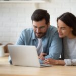 happy-young-mixed-race-married-spouse-making-purchases-online_656932-4392