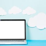 paper-clouds-near-laptop_23-2147772323